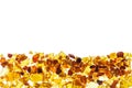 Amber abstract background made of small pieces lying at the bottom Royalty Free Stock Photo