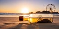 a bottle of beer is on the beach with a ferris wheel in the background Royalty Free Stock Photo