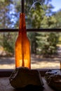 Amber bottle on window sill