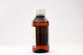 An amber colored medicine pet bottle with transparent dosage cap