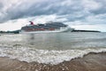 Amber Cove/Dominican Republic - Nov 22, 2016: Carnival Magic cruise ship at the port of Amber cove. Ship view with waves at Royalty Free Stock Photo