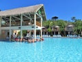 Amber Cover Cruise port in Puerto Plata, Dominican Republic - 12/12/17 - people drinking at a swim up bar in a pool