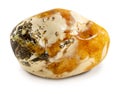 Amber gemstone isolated on white background. Polished beautiful amber stone. Stone texture. Royalty Free Stock Photo