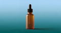 Amber Glass Bottle with Dropper for Essential Oils or Serum on Gradient Background with Studio Lighting Mockup Display Royalty Free Stock Photo