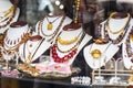 Amber jewelry in store window. Counter with baltic amber stone jewellery, touristic souvenirs, pendants and necklaces for sale Royalty Free Stock Photo