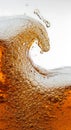 Amber liquid with bubbles and splash beverage Royalty Free Stock Photo