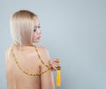 Amber long necklace sautoir on female back on white background Royalty Free Stock Photo