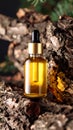 Amber oil bottle on rustic wood bark with natural background Royalty Free Stock Photo