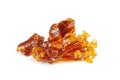 Amber pieces of cannabis wax clsoeup. concentrate dab with high thc