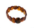 Amber stone bracelet isolated on white Royalty Free Stock Photo