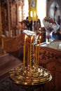 Ambiance of church, candles and bokeh yellow lights