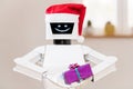 White robot with gift in his hands