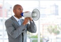 Ambitious businessman yelling through a megaphone Royalty Free Stock Photo