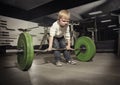 Ambitious, Determined little boy trying to lift