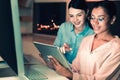 Ingenious interns sitting with tablet