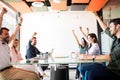 Positive and ambitious business team in meeting room