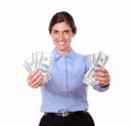 Ambitious young woman holding cash dollars