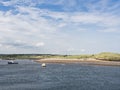 Amble harbour, Northumberland, UK at low tide with seabirds Royalty Free Stock Photo