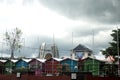 many beautiful colorful little huts near a big gong Royalty Free Stock Photo