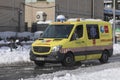 Ambulance arrives at the hospital Gregorio MaraÃÂ±ÃÂ³n, on a snowy day