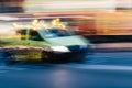 Ambulance in a Blurred City Scene