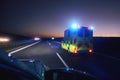 Ambulance car of emergency medical service on highway at night Royalty Free Stock Photo