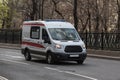 Ambulance car moves along a city street Royalty Free Stock Photo