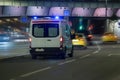 Ambulance car moves at night along a city street Royalty Free Stock Photo