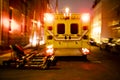 An ambulance car parked on the side street at night Royalty Free Stock Photo