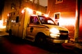 An ambulance car parked on the side street at night Royalty Free Stock Photo