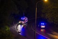 Ambulance car and police car at the scene of the accident