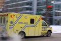 Ambulance car speeding city blurred motion Royalty Free Stock Photo