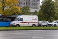 Ambulance car on the street in city summer sunny day. Side view. Residential area. Moscow, Russia