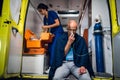 Ambulance car, a young nurse is checking her medical kit to provide the first aid to her patient Royalty Free Stock Photo