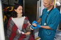 Ambulance crew member is giving first aid to a woman Royalty Free Stock Photo