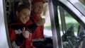 Ambulance crew showing thumbs up, professionals on duty provide first aid Royalty Free Stock Photo