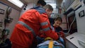 Ambulance doctors saving life of victim in ambulance vehicle