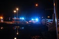 Ambulance with flashing blue lights in the Netherlands at incident location along the ring canal.