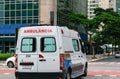 An ambulance in the middle of the traffic going to the rescue call