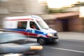 Ambulance in motion driving down the road Royalty Free Stock Photo