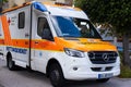 ambulance parked at church, concept providing urgent medical assistance, German medical services, Rapid Response Vehicles,