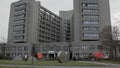 Ambulance passing by Big Hospital Building Vivantes Klinikum am Urban