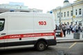 Ambulance and people on the street. Moscow.