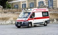 Ambulance in the square of the people in first aid