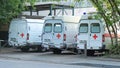 Ambulances are parking next to ambulance station ready for immediate emergency services.