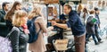 Ambulant male seller of hot chestnuts marron chauds Royalty Free Stock Photo