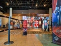 AMC movie theater foyer with ticket stand and refreshment counter.