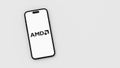 Amd Logo on Mobile Phone Screen on Gray Background with Copy Space