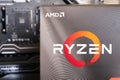 AMD Ryzen CPU box in front of a motherboard Royalty Free Stock Photo