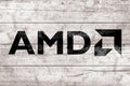 AMD sign. Close-up AMD logo on wooden surface Royalty Free Stock Photo